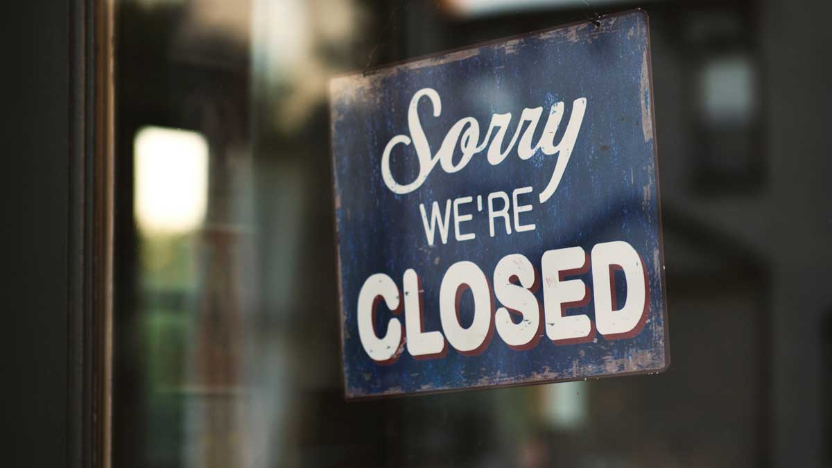 Sorry we're closed sign in shop window